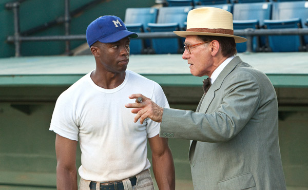 Chadwick Boseman as Jackie Robinson and Harrison Ford as Branch Rickey in Brian Helgeland's 42