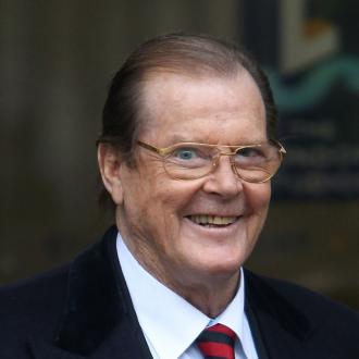 Sir Roger Moore gave up gambling when he started to wear a <b>lucky tie</b> to try <b>...</b> - sir_roger_moore_555629
