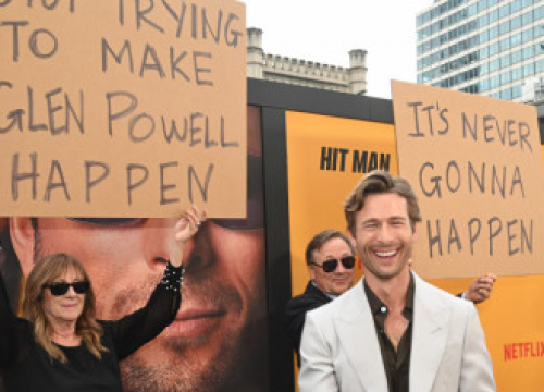 Glen Powell Reflects On Playing 'A Lot Of Different Characters' In Hit Man: 'It's The Greatest Joy'