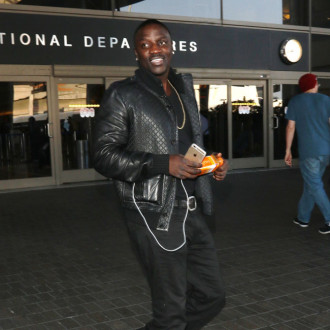 Akon felt under pressure to 'distance himself from his African background'