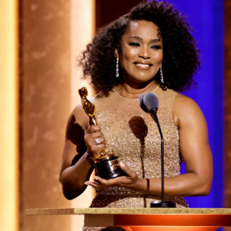Angela Bassett thanks fans for 'decades and decades' of support as she accepts honorary Oscar