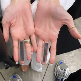 ‘Does it say F*** Brad?!’ Angelina Jolie sparks rumours she’s used new mystery finger tattoos to ‘flip a couple of birds’ to her ex