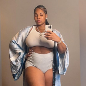 Ashanti reveals she secretly gave birth to a baby boy in July as she shows off postpartum body