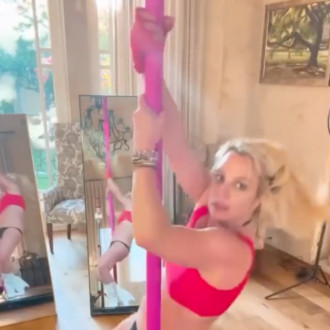 Britney Spears thought to have taken swipe at her sister and ex-husband with pole dancing video – and snake caption!