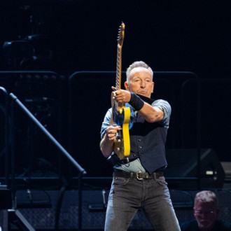 The Boss Bruce Springsteen signs kid's skipping school note at San Francisco gig
