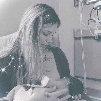 Christina Perri welcomes 'magical rainbow' baby girl