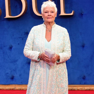 Dame Judi Dench's late husband persuaded her to take Bond role