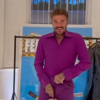 David Beckham rips purple wedding suit in 25th anniversary stunt