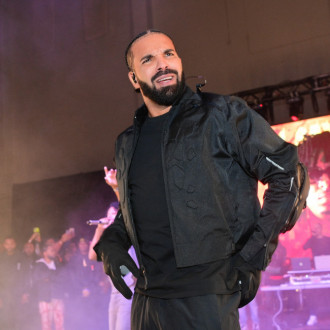 Drake almost hit in the face by book at gig