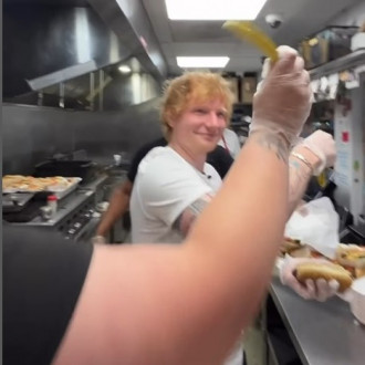 Swearing, sausages and Sheeran: Customers get a surprise as Ed serves hot dogs at iconic food concession
