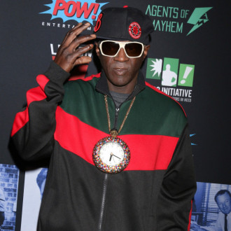 Flavor Flav uses his 'big mouth' to support Team USA