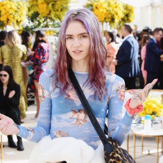 Grimes feeling 'less gay' after pregnancy