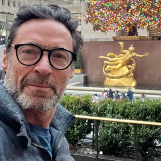 Hugh Jackman got told off by security for going too close to a Christmas tree!