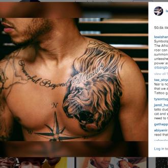 Lewis Hamilton gets lion tattoo 