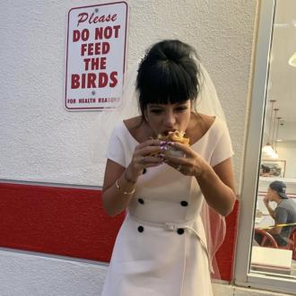 Lily Allen shares snaps from wedding to David Harbour and celebrates with a burger
