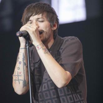Louis Tomlinson has been 'cooking' up new music