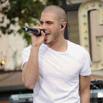 Max George catches fire during concert