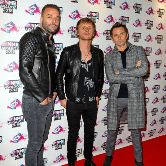 Muse want to be less 'vague and strange' on new record