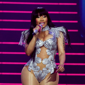 Nicki Minaj seemingly arrested at an airport as officials tell her they need to 'search everything'