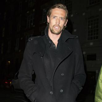 Peter Crouch guards mansion with life-size cardboard cut out 