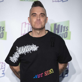 Robbie Williams and Guy Chambers are working on a new musical