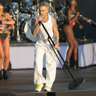 Robbie Williams joined by Danny Dyer, Gaz Coombes and brass band during Glastonbury tribute at Hyde Park gig