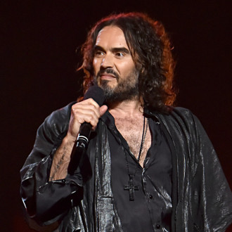 Russell Brand accused of pinning down woman in locked dressing room
