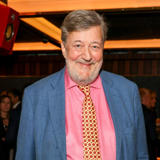 Stephen Fry rushed to hospital with rib and leg injuries after plunging from 6ft-high stage during AI talk