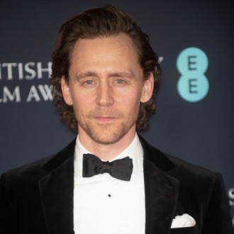 Tom Hiddleston stands in for King Charles at charity gala